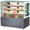 Square glass bakery display fridge with black base, showcasing cakes, pastries, and beverages for cafes and dessert shops.