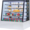 Triangle-shaped refrigerated showcase for cakes, desserts, and beverages, perfect for cafes and restaurants.