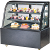 Black curved glass display fridge showcasing cakes and desserts, perfect for bakeries, cafes, and pastry shops.